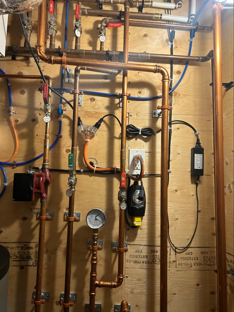 Hydronic heating system piping with pumps and controls